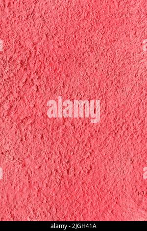 a concrete wall painted with red spray paint Stock Photo