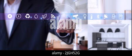 Man hand point smarth home GUI in livingroom. Hand use smart screen smart home automation assistant on a virtual screen and a user touching a button Stock Photo