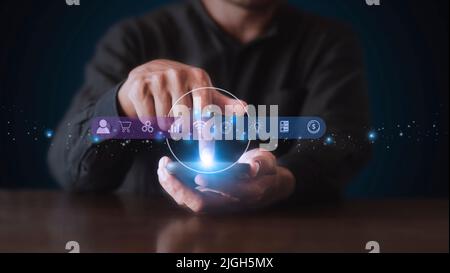 Businessman using phone and touching on virtual screen contact icons. Contact us, Customer support hotline people connect. Man hands touch smartphone Stock Photo