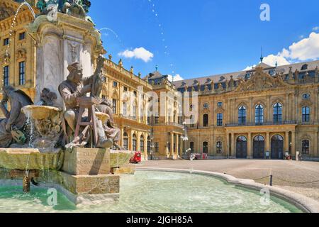 Würzburg, Germany - July 2022: Statue of fountain called 'Frankoniabrunnen' in front of castle 'Würzburg Residence' Stock Photo