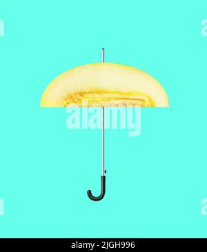 Contemporary art collage. Creative colorful design with umbrella made from melon isolated on mint background Stock Photo