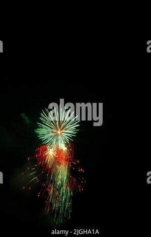 Vertical shot of exploding fireworks in a dark sky Stock Photo - Alamy