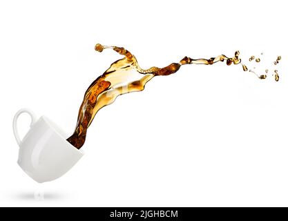 coffee spilling out of a cup isolated on white background Stock Photo