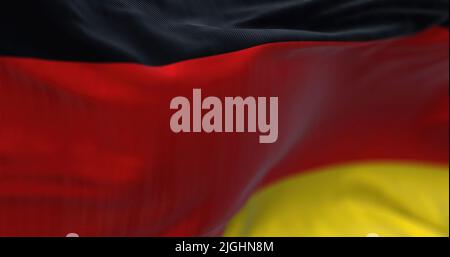 Close-up view of the German national flag waving in the wind. Germany is an European country. Stock Photo