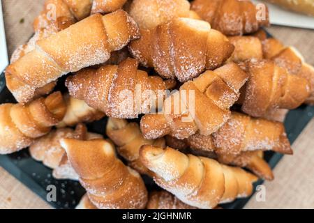 Cakes bagels. Crispy croissants, crescent. Food on grey background, Closeup view Stock Photo
