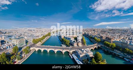 Paris aerial panorama with river Seine, Pont Neuf bridge, ile de la cite and Notre-Dame church, France. Holidays vacation destination. Panoramic view Stock Photo