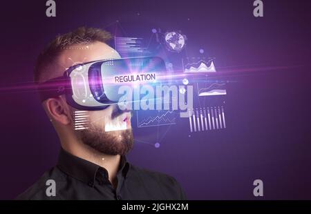 Businessman looking through Virtual Reality glasses Stock Photo