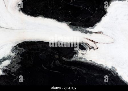 White natural marble with contrast black spots. Stock Photo