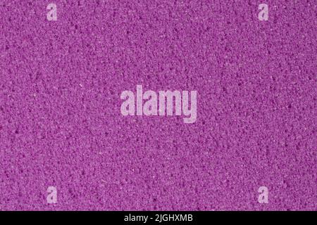 Porous violet foam background, EVA texture with contrast surface. Stock Photo