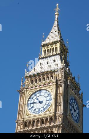 Big Ben clock tower close up in London on the blue sky. Symbol of London, United Kingdom Stock Photo