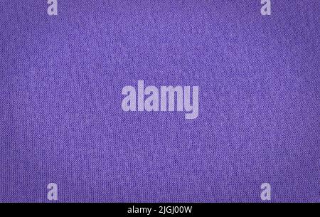 Warm cyan blue colored knitted wool background. Beautiful knitted denim colored wool textiles as a background. Stock Photo