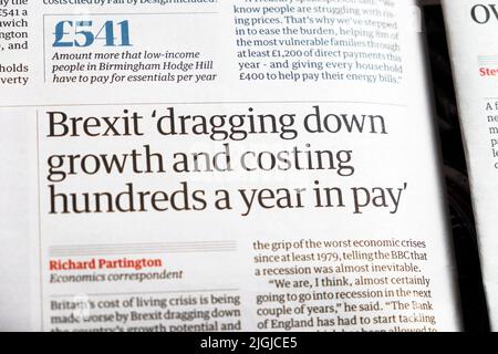 Brexit 'dragging down growth and costing hundreds a year in pay' Guardian newspaper headline British economy article 22 June 2022 London England UK Stock Photo