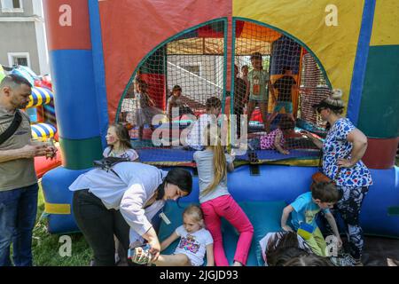 Odessa, Ukraine. 31st May, 2022. Children seen on inflatable rides at the children's party in Odessa People's Church. In connection with the military actions of the Russian Federation, there are many internally displaced people in Odessa. Children's holiday was organized for them and their children. (Photo by Viacheslav Onyshchenko/SOPA Images/Sipa USA) Credit: Sipa USA/Alamy Live News Stock Photo