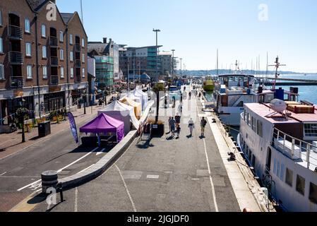 Poole Quay on a bright, sunny summer morning, Dorset, UK Stock Photo