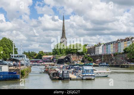 Looking towards St Mary Redcliffe Church with moored boats in between, in Bristol at the floating harbour Stock Photo