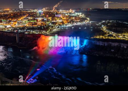 Aerial view of Niagara Falls American Falls winter illumination in twilight time. Stunning landscape dusk to night. Stock Photo