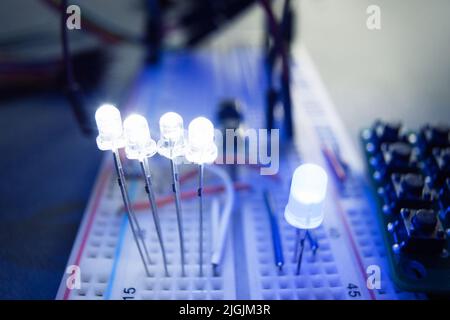 LED Light-emitting diodes on electrical breadboard Stock Photo
