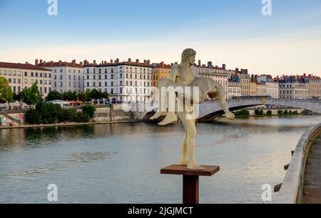 Two men statue named The Weight of Oneself, on a bank of Saone rive, Lyon, France Stock Photo
