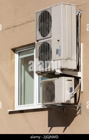 air conditioning unit Central split system hanging outside the building Stock Photo