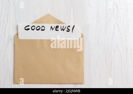 Opened yellow envelope with paper letter inside Stock Photo