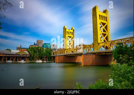 Gold Tower Bridge and Sacramento River in Sacramento, California Stock Photo