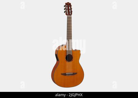 Classical guitar isolated on white background close up. Acoustic six-string wooden guitar. Musical instrument. Rock or jazz equipment Stock Photo