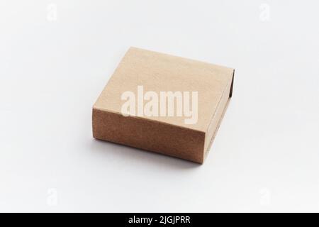 Lots of brown cardboard boxes. Cardboard mailbox isolated on a white background. Open rectangular small brown box for transporting goods isolated on a Stock Photo