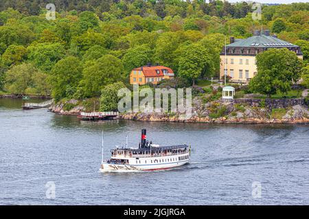 Tourist boat MV Ostana I (built 1906) leaving Djurgården in the Stockholm Archipelago, Sweden Stock Photo