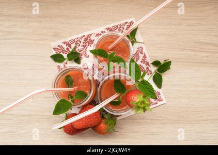 top view of three strawberry milkshakes in a small glass Stock Photo