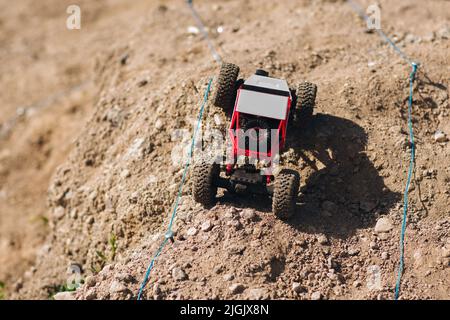 Toy buggy car racing on rally track Stock Photo