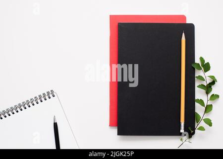 Black and red notepads with open one, free space Stock Photo