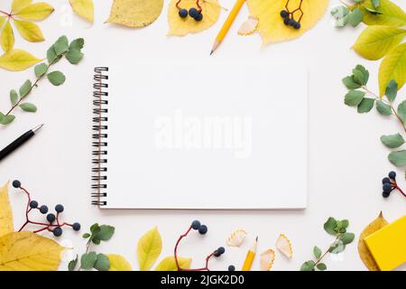 Blank notepad in autumn leaves frame, free space Stock Photo