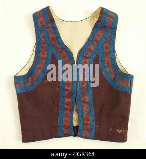 Livstycke Women's life. Of dark brown woolen fabric garnished with brown and blue floral silk ribbon, lining Blågarnsväv. Allmoged costume. Gift 1914 by Mrs. Tingberg in Karlskrona. Stock Photo