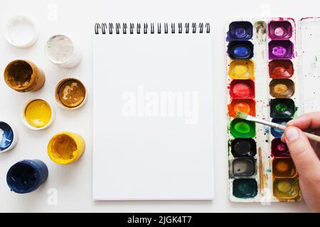 Artist painting with watercolor dye flat lay Stock Photo