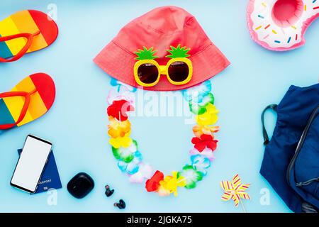 Top view summer vacation concept with necessary travel stuff. Backpack, bucket hat, funny sunglasses, flower necklace, flip flops, biometric passport, Stock Photo