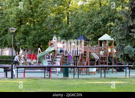 Estonia children; Young children aged 5-10 years playing in a children's playground or play area, Tartu, Estonia, Europe Stock Photo