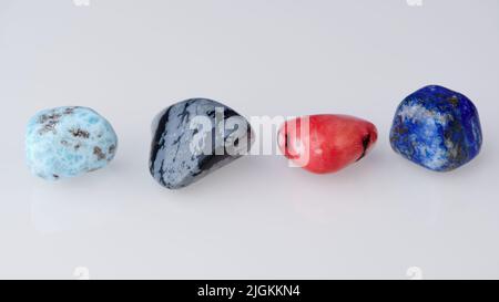 four different gemstones in a row against white background Stock Photo