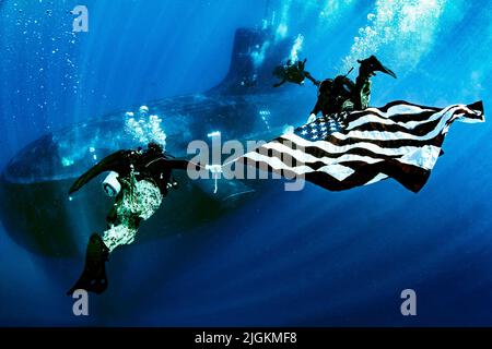 At Sea. 1st July, 2022. Military members from Naval Special Warfare Group Eight display the national ensign as they perform dive operations while underway on a Virginia Class fast-attack submarine USS New Mexico (SSN 778). Naval Special Warfare organizes, mans, trains, equips, deploys, sustains, and provides command and control of NAVSPECWAR forces to conduct full spectrum undersea special operations and activities worldwide in support of Geographic Combatant Commands and national interests. Credit: Christopher Perez/U.S. Navy/ZUMA Press Wire Service/ZUMAPRESS.com/Alamy Live News Stock Photo