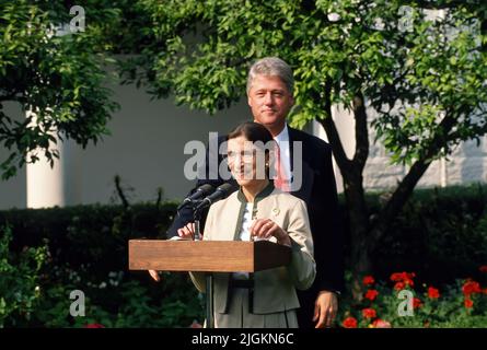 WASHINGTON DC - AUGUST 3, 1993 President William Clinton introduces Judge Ruth Bader Ginsburg to the media during a ceremony in the Rose Garden of the White House after the Senate Judiciary Committee voted unanimously to confirm Judge Ginsburg as an Associate Justice of the Untied States Supreme Court. Stock Photo