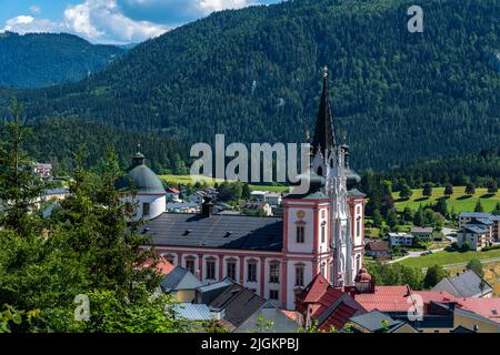 Beautiful aerial view of Mariazell Basilica, a Roman Catholic church, on sunny summer day with the Alps and blue sky cloud, Styria, Austria Stock Photo