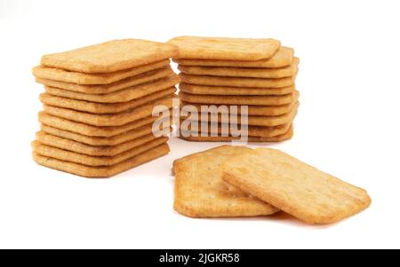 Salty square crackers isolated on bright background. Stock Photo