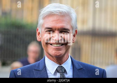 London, UK. 11th July, 2022. Phillip Schofield, TV presenter, smiles in Westminster this evening after attending an event at the Houses of Parliament. Credit: Imageplotter/Alamy Live News Stock Photo