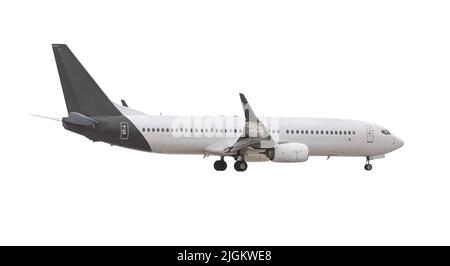 Modern passenger airliner during flight, isolated on white background, side view close up Stock Photo