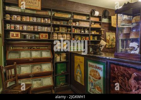 Recreation of inside small Victorian food shop the Abbey House Museum, Kirkstall, West Yorkshire, UK.on the display in the UK. Stock Photo