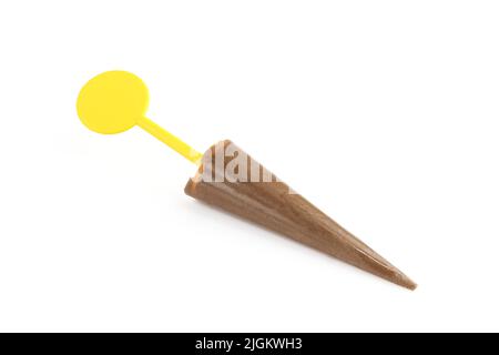 Chocolate candy snack for kids on plastic yellow stick isolated on white background Stock Photo