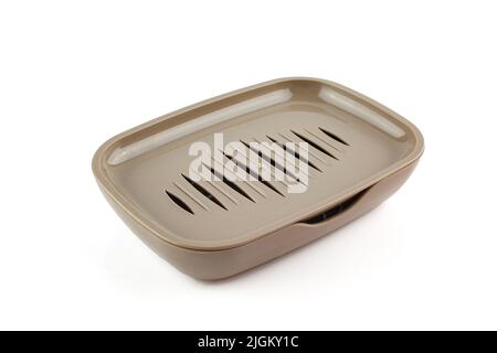 Plastic brown soap dish isolated on white background.Empty shiny soap holder Stock Photo