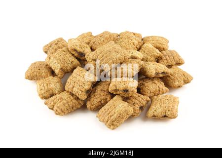 Cereals filled with delicious chocolate .Pillows made with whole grains and isolated on white background Stock Photo