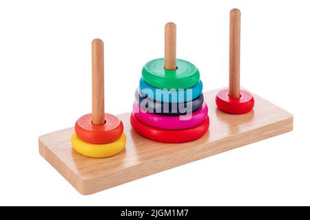 Wooden puzzle tower of hanoi with color rings isolated on white background. Toy for kids. Stock Photo