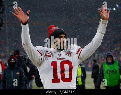 Green Bay, United States. 22nd Jan, 2022. San Francisco 49ers' Jimmy Garoppolo (10) waves to the crowd after beating the Green Bay Packers 13-10 in their NFC divisional playoff game at Lambeau Field in Green Bay, Wisconsin, on Saturday, Jan. 22, 2022. (Photo by Nhat V. Meyer/Bay Area News Group/TNS/Sipa USA) Credit: Sipa USA/Alamy Live News Stock Photo