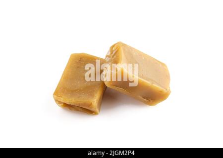 Two hard caramel candies isolated on white background Stock Photo